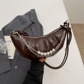 Dark brown croissant bag with pearl charms and silver chains for women's crossbody wear - Coffee