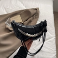 Chic black crescent moon shoulder bag with quilted texture and pearl chain detail - Black