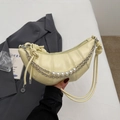 Chic cream croissant bag with pearl and chain decor, featuring stylish knotted straps - Yellow