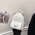 Chic white quilted mini backpack with silver metal turn-lock and chain straps - White