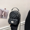 Quilted black mini backpack with silver chain straps and metallic turn-lock closure - Black