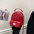 Quilted red leather mini backpack with silver chain strap and metal turn-lock closure - Red