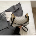 Detail of beige crescent bag with geometric pattern, black leather strap and gold chain - White and Black