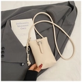 Chic beige lychee leather crossbody phone bag with metal buckle and heart charm - White
