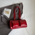 Vintage red glossy tote bag with dual front pockets and long shoulder straps - Red