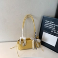 Yellow baguette shoulder bag with lychee texture and bow accents in minimalist style - With Charm / Yellow