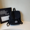Minimalist black canvas backpack with flap cover and side pockets for casual travel - One Size / Black