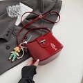 Chic burgundy patent leather bucket bag with silver clasp and cute boy doll pendant - Red with Pendant