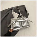 Chic silver metallic tote bag with bow detail and front pockets for summer fashion - Silver