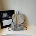 Minimalist beige travel backpack for women with flap cover and functional side pockets - One Size / Khaki
