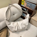 Chic beige pleated crescent bag with crocodile texture and wide shoulder strap - White