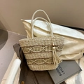 Handwoven straw tote bag in cream white with hollow mesh pattern and tassel charm - White
