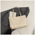Beige tote bag with marble pattern and long straps on a grey blazer for daily style - White Without Pendant