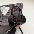 Glossy black bowling handbag with bow detail and colorful beaded charms for women - Black