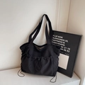 Minimalist black nylon tote bag with functional drawstring pocket and wide shoulder strap - Black