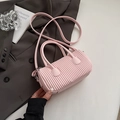 Fashionable light pink pleated cylinder bag with top handles and adjustable strap - Pink