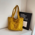 Minimalist yellow commuter tote bag with large drawstring pocket and versatile shoulder straps - Yellow