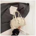 Beige heart-buckle dumpling bag with dual handles and adjustable shoulder strap - White