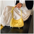 Lemon yellow bow dumpling bag in lychee pattern PU leather with silver zipper closure - Yellow