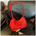 Red bow tie dumpling bag in lychee pattern faux leather with silver zipper detail - Red