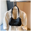 Minimalist black dumpling bag with bow detail and lychee pattern leather finish - Black