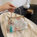 Elegante bolso de brocado chino azul claro con asa de metal y bordado de flores de abanico - Azul