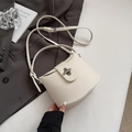Chic off-white litchi grain leather bucket bag with silver twist lock and slim straps - White Without Pendant
