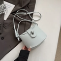 Minimalist light blue bucket bag with lychee texture and silver twist lock detail - Blue Without Charm