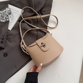 Beige lychee-textured bucket bag with silver metal swivel lock and adjustable strap - Khaki (No Pendant)