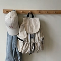 Minimalist beige nylon drawstring backpack with matching white smiley face baseball cap - Off-white