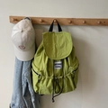 Grass green nylon drawstring backpack featuring a white woven label and casual texture - Green
