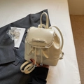 Creamy white ballet-style mini backpack with lace trim and bow accent for women - White