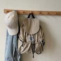 Beige nylon drawstring backpack with brand label and white smiley face baseball cap - Khaki