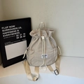 Minimalist cream drawstring backpack with adjustable straps and logo detail - Off White