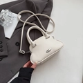Chic shell-shaped mini handbag in creamy white pebbled leather with silver hardware - White