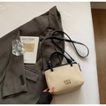 Beige woven bucket bag with black leather straps and metal lettering for women - No Pendant / Black