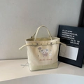 Borsa tote a righe color crema con simpatica stampa di cane e finiture in pelle - Strisce Gialle