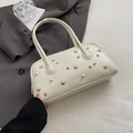 White faux leather bowling bag with pearl accents and silver star hardware details - White
