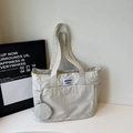 Minimalist cream canvas tote bag with large outer pocket and round mini coin purse - Off-white
