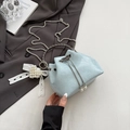 Light blue bucket bag with pleated texture, silver chain strap and pearl heart charm - Blue