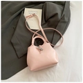Elegant light pink leather bucket bag with silver buckle and adjustable shoulder strap - Pink Without Pendant