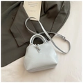 Light blue bucket bag with silver bamboo toggle and adjustable strap in minimalist style - Blue Without Charm