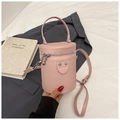 Chic pink woven PU leather bucket bag with top handle and adjustable shoulder strap - Pink