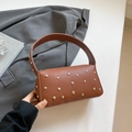 Brown litchi-grain leather handbag with silver stud accents and wide shoulder strap - Brown