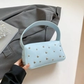 Light blue lychee texture handbag with silver round rivets and chic handle detail - Blue
