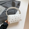 White lychee leather shoulder bag with silver rivet studs and a wide handle strap - White