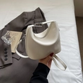 White lychee pattern crossbody bucket bag with silver metal buckle and sleek strap - White
