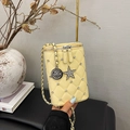 Quilted light yellow mini crossbody phone bag with star charm and metal chain strap - Yellow
