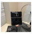 Detail of gothic black faux crocodile bag with silver cross and chain trim decoration - Black