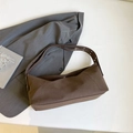 Large dark brown canvas shoulder bag with wide strap and metallic eyelet details - Brown